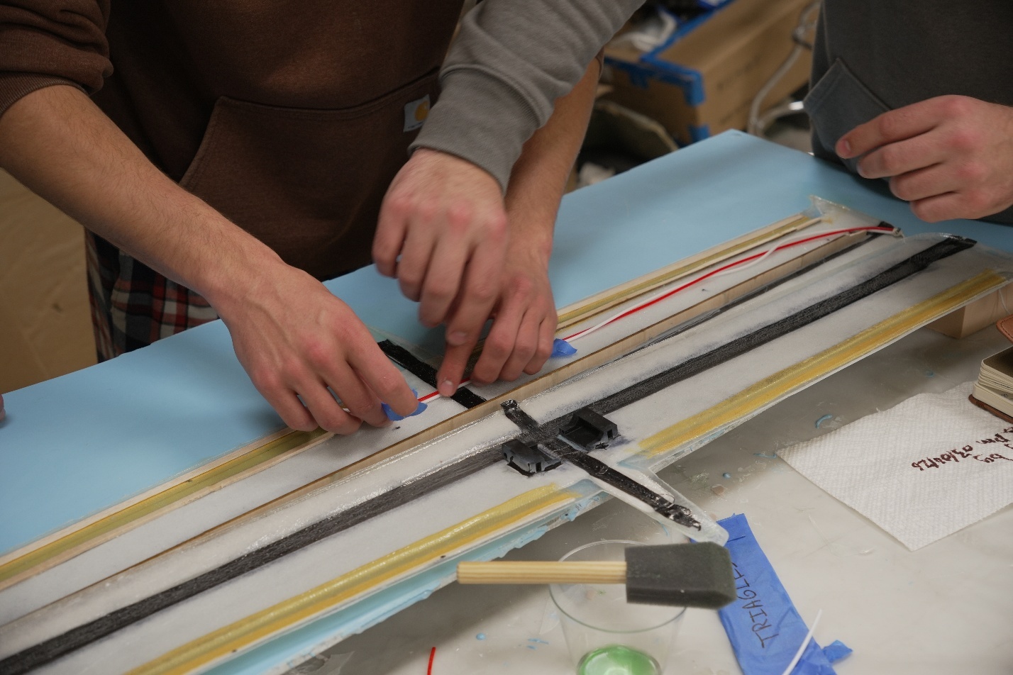 Bonding internal components into wing